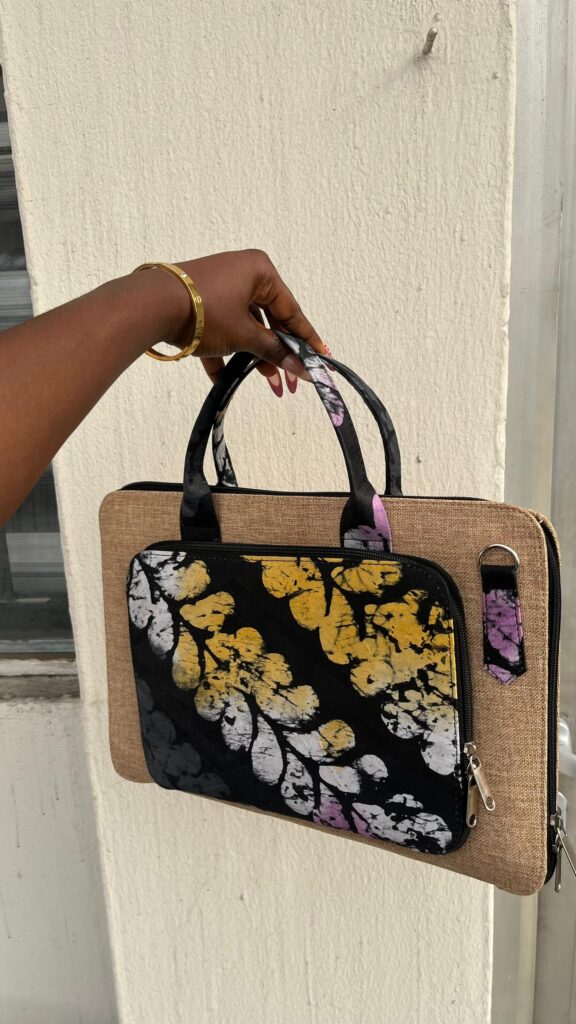Premium corporate souvenir combos featuring padded Ankara laptop bags and customized executive notebooks.
