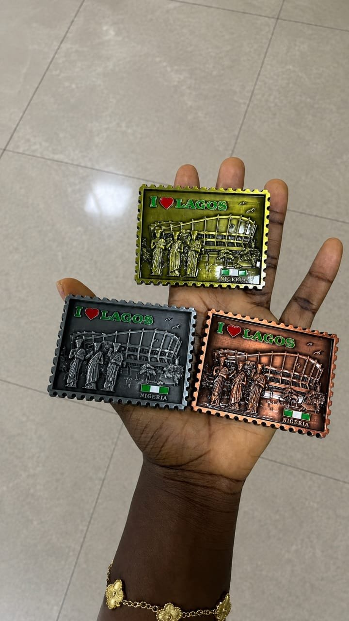 Fridge magnets made in Nigeria displayed on a fridge abroad