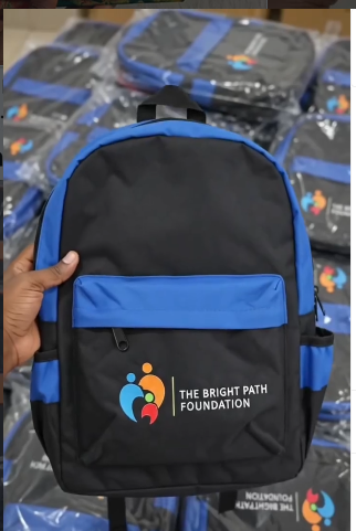 Blue Bulk Student Backpack for primary education programs showing heavy duty construction and side pockets.