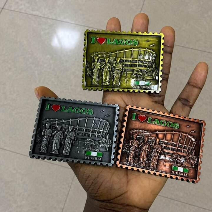Authentic Nigerian fridge magnets made in Nigeria displayed on a fridge abroad