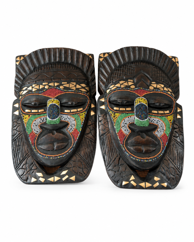 Hand carved African wooden mask showing traditional carving detail and symbolism