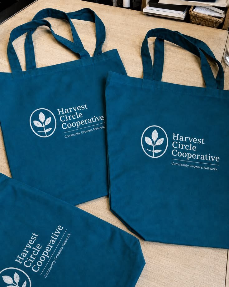 Custom corporate souvenir ideas in Nigeria: branded Ankara tote bag, engraved flask and embroidered notebook arranged on a table